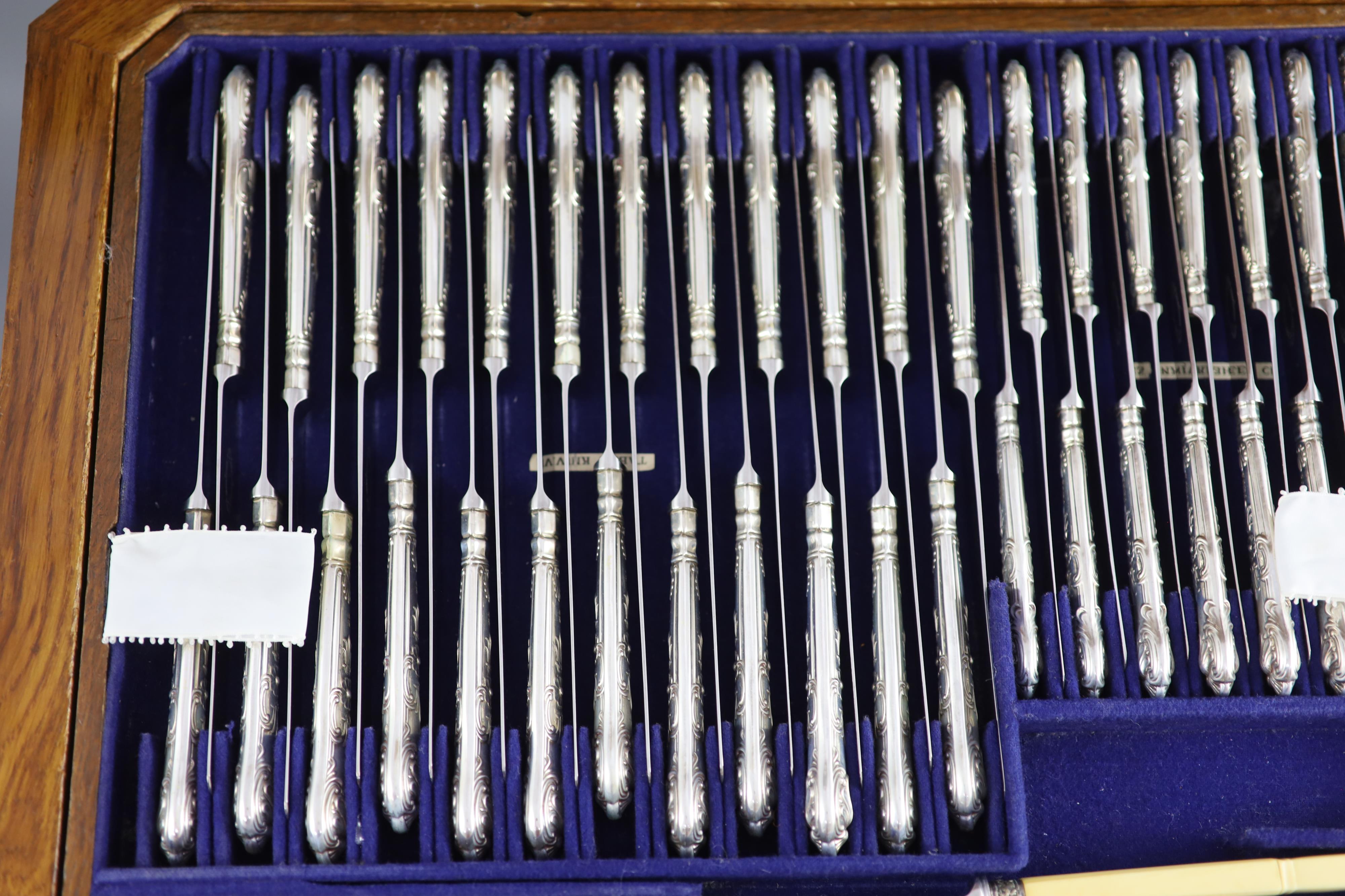 A part canteen of late Victorian silver double struck Queens pattern cutlery by Carrington & Co